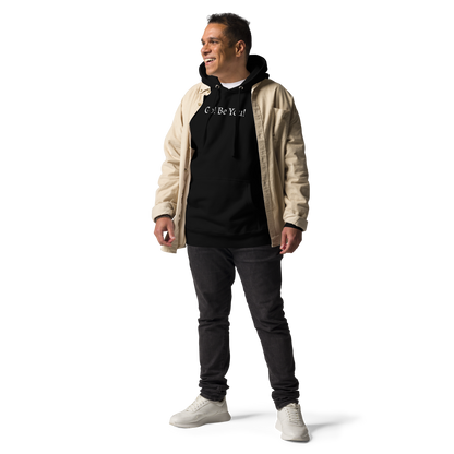 "Go! Be You!" printed on a black unisex hoodie worn by a male with a jacket on top