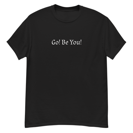 "Go! Be You!" printed on a black unisex classic tee laying on a flat surface