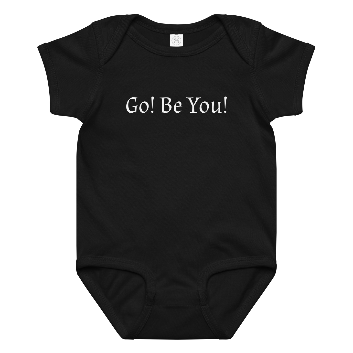"Go! Be You!" printed on a black baby jersey bodysuit laying on a flat surface amongst other clothes