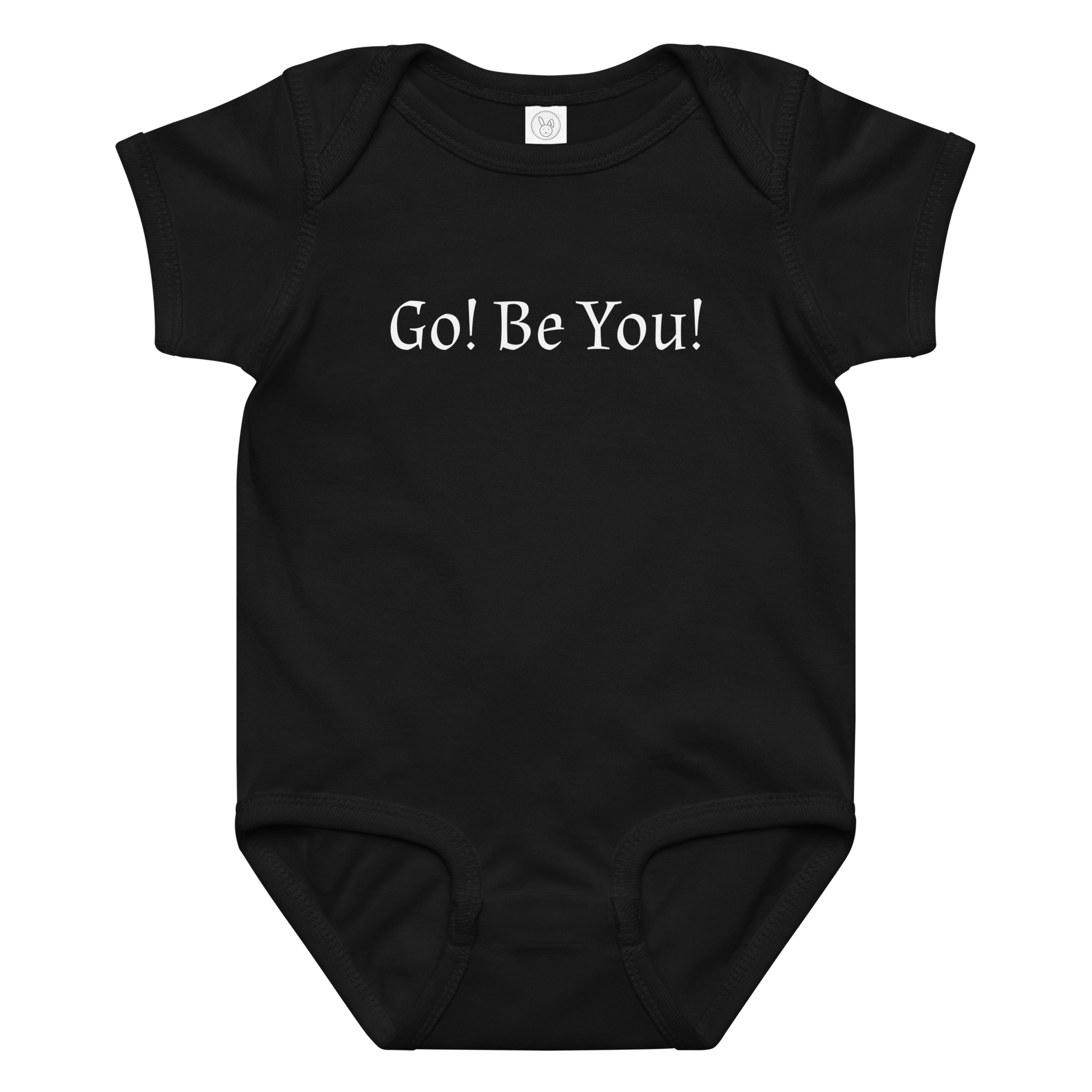 "Go! Be You!" printed on a black baby jersey bodysuit laying on a flat surface amongst other clothes