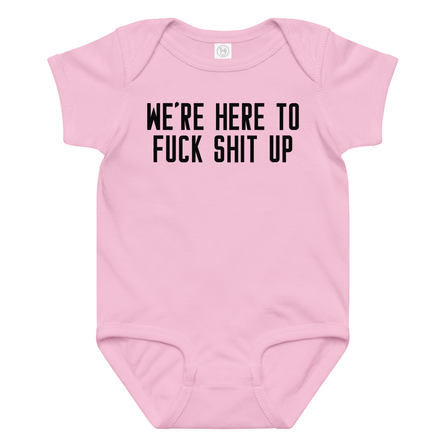 "We're Here To Fuck Shit Up" printed on a pink baby jersey bodysuit laying on a flat surface amongst other clothes