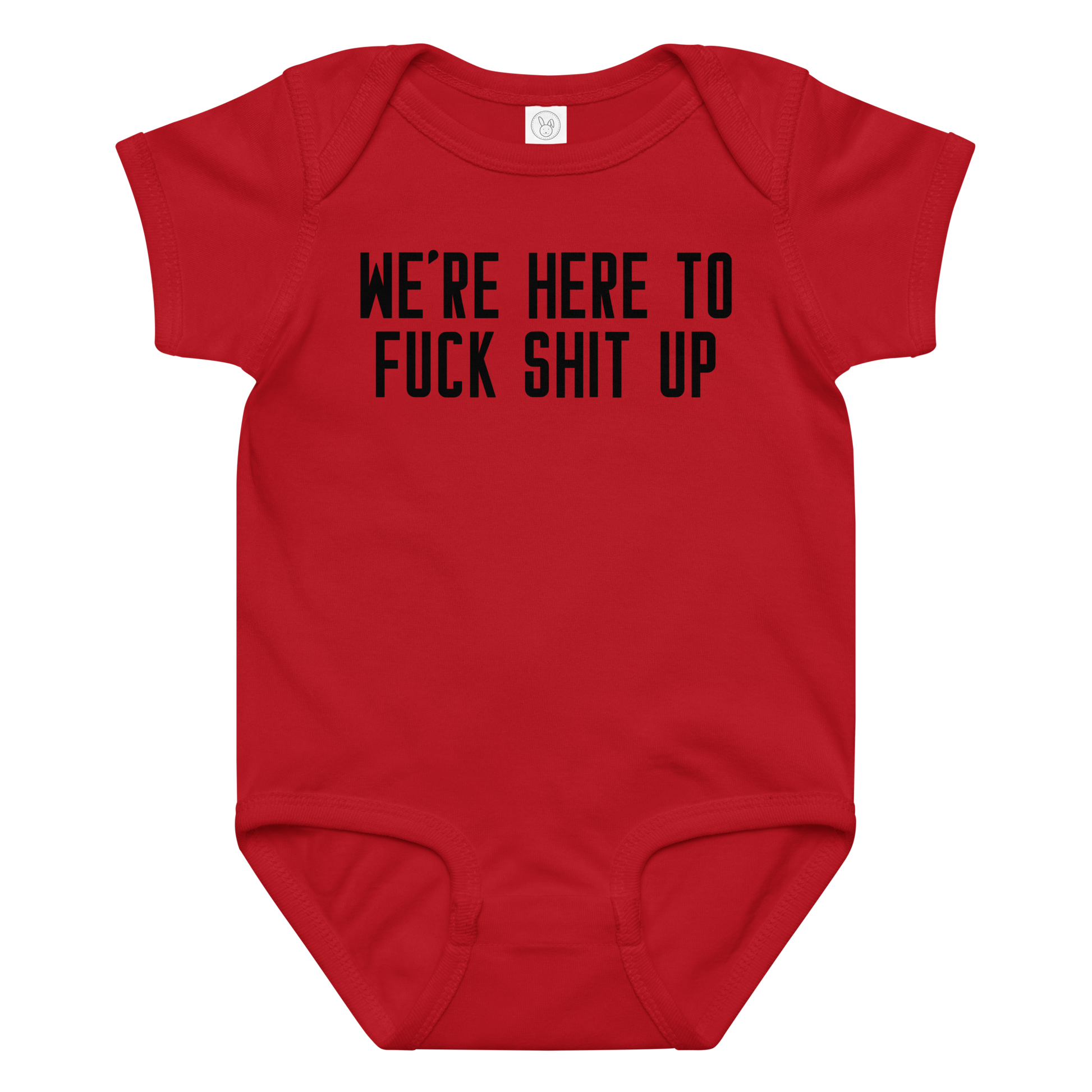 "We're Here To Fuck Shit Up" printed on a red baby jersey bodysuit laying on a flat surface amongst other clothes
