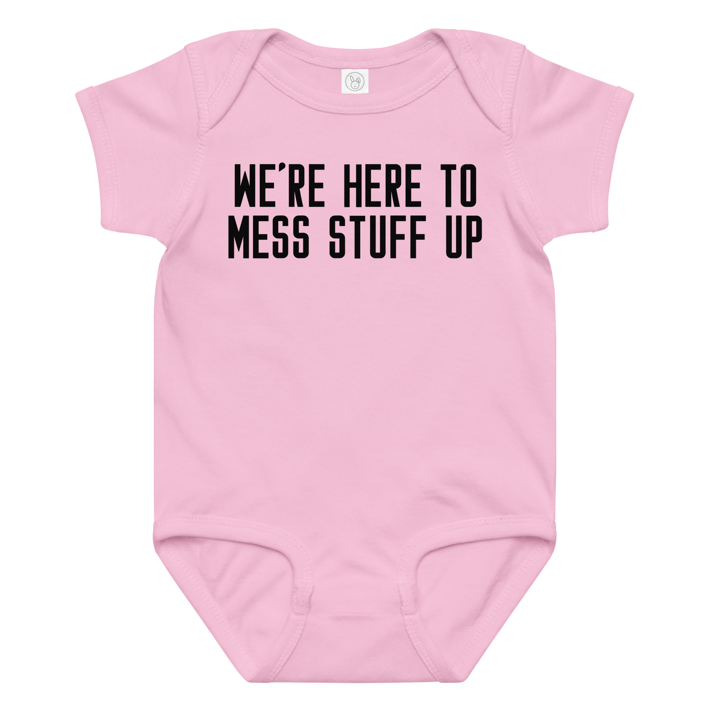 "We're Here To Mess Stuff Up" printed on a pink baby jersey bodysuit laying on a flat surface amongst other clothes