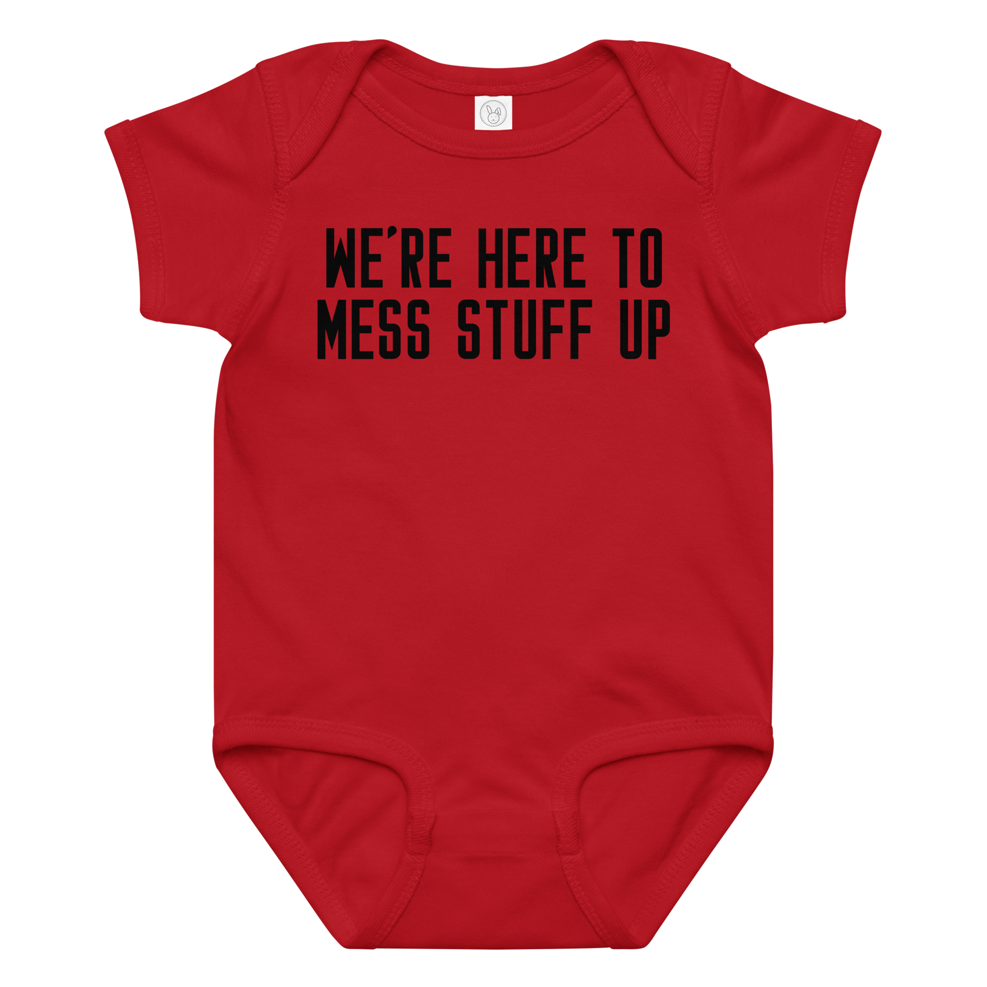"We're Here To Mess Stuff Up" printed on a red baby jersey bodysuit laying on a flat surface amongst other clothes
