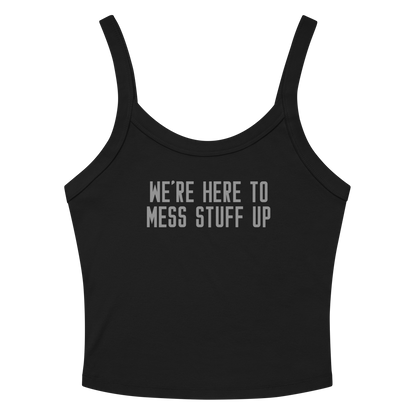 "We're Here To Mess Stuff Up" printed on a solid black blend women's micro-rib tanktop laying on a flat surface amongst sunglasses and shorts