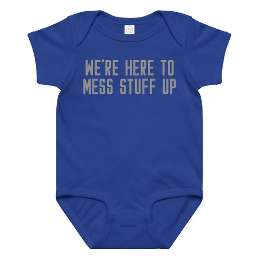 "We're Here To Mess Stuff Up" printed on a royal baby jersey bodysuit laying on a flat surface amongst other clothes
