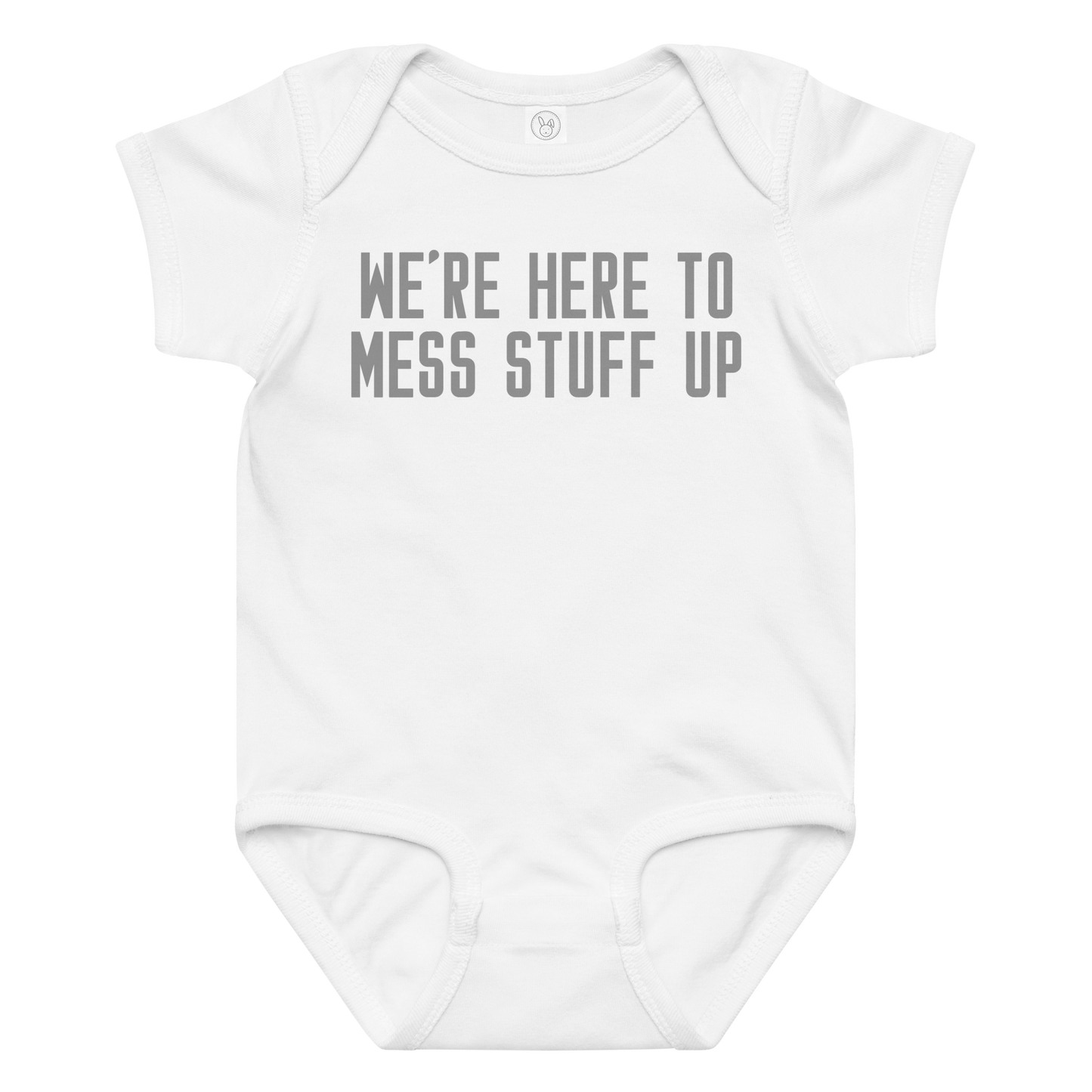 "We're Here To Mess Stuff Up" printed on a white baby jersey bodysuit laying on a flat surface amongst other clothes