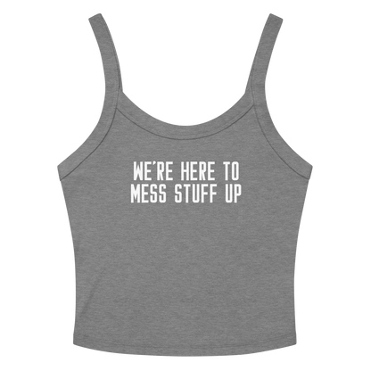 "We're Here To Mess Stuff Up" printed on a athletic heather women's micro-rib tanktop laying on a flat surface amongst sunglasses and shorts