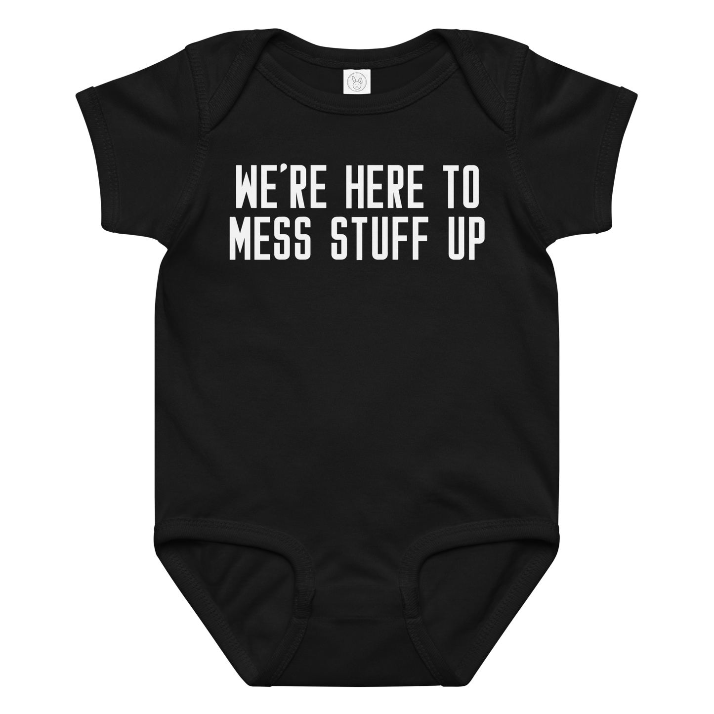 "We're Here To Mess Stuff Up" printed on a black baby jersey bodysuit laying on a flat surface amongst other clothes