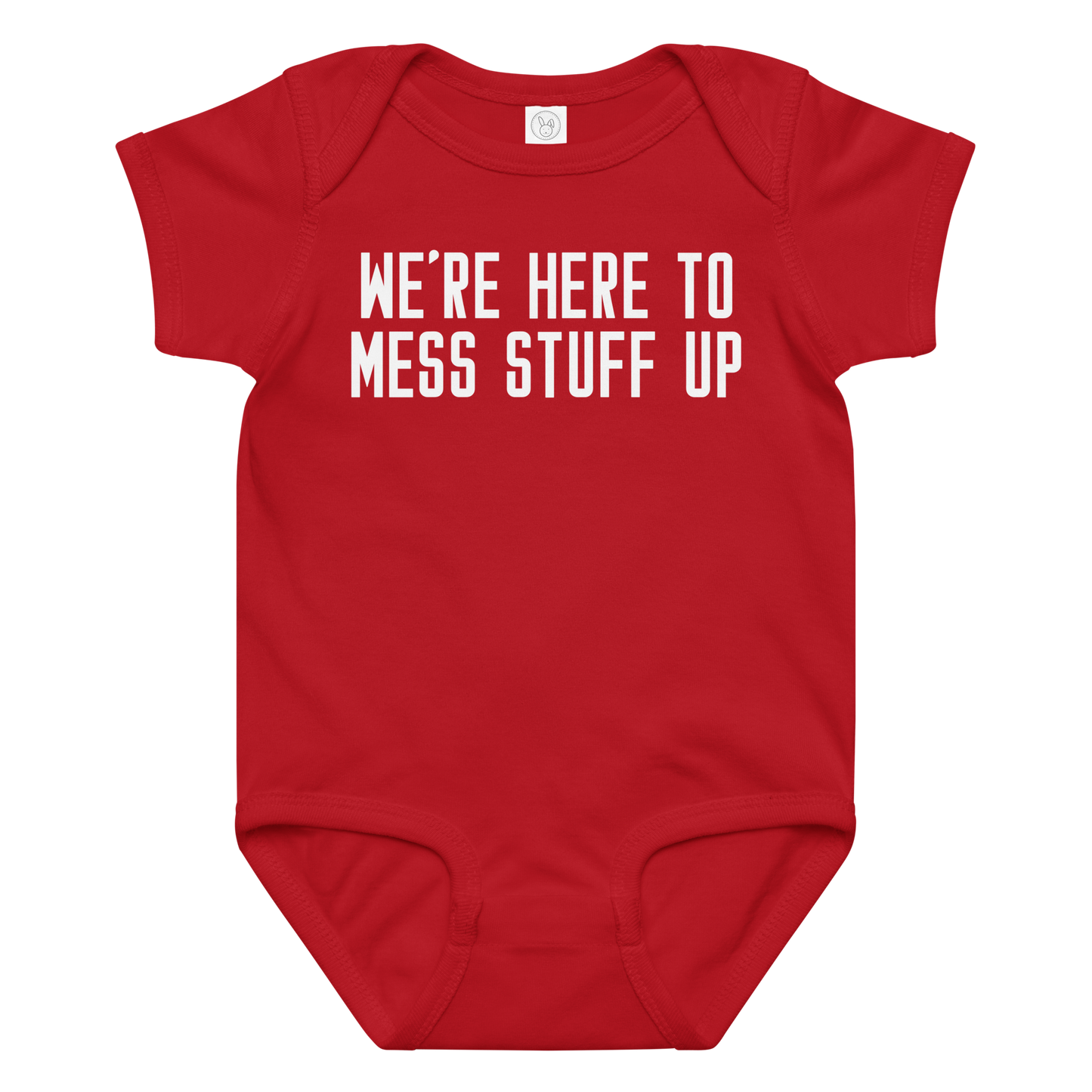 "We're Here To Mess Stuff Up" printed on a red baby jersey bodysuit laying on a flat surface amongst other clothes
