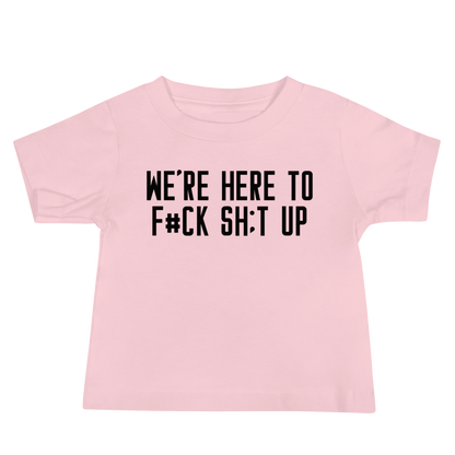 "We're Here To F#Ck Sh:t Up" printed on a pink baby jersey short sleeve tee laying on a flat surface