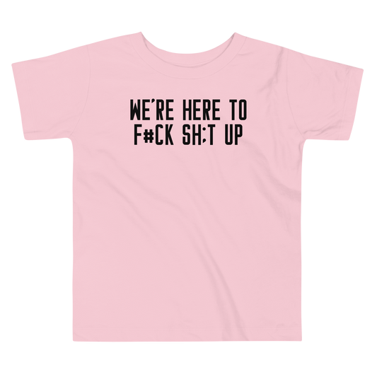 "We're Here To F#Ck Sh:t Up" printed on a pink toddler short sleeve tee laying on a flat surface