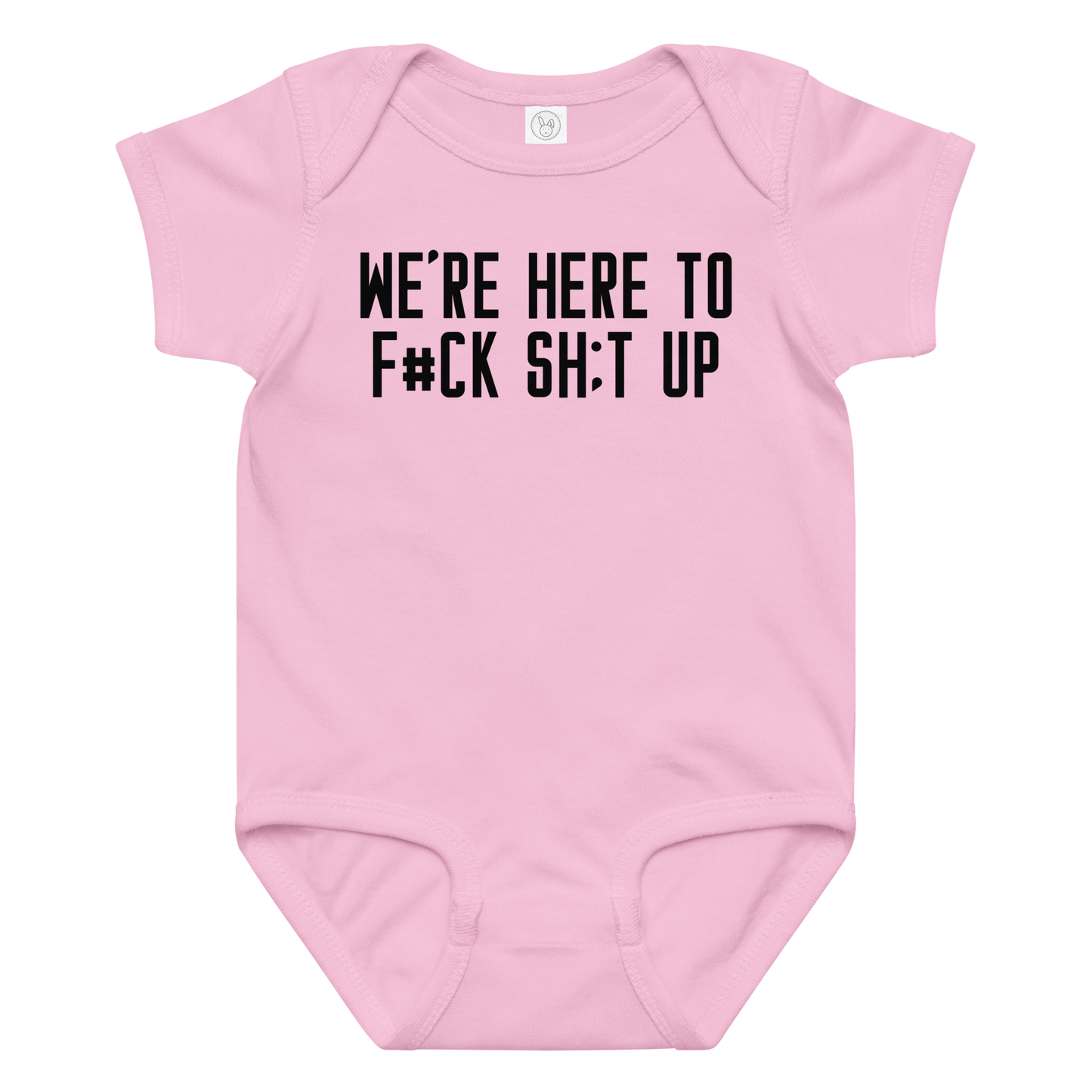 "We're Here To F#Ck Sh:t Up" printed on a pink baby jersey bodysuit laying on a flat surface amongst other clothes