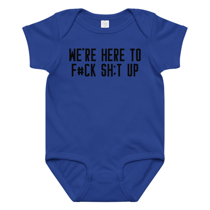 "We're Here To F#Ck Sh:t Up" printed on a royal baby jersey bodysuit laying on a flat surface amongst other clothes