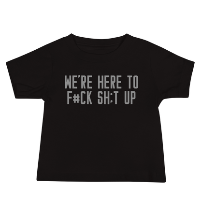 "We're Here To F#Ck Sh:t Up" printed on a black baby jersey short sleeve tee laying on a flat surface