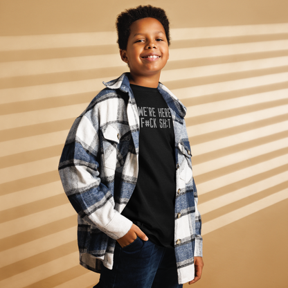 "We're Here To F#Ck Sh:t Up" printed on a black youth classic tee worn by a male also wearing a jacket