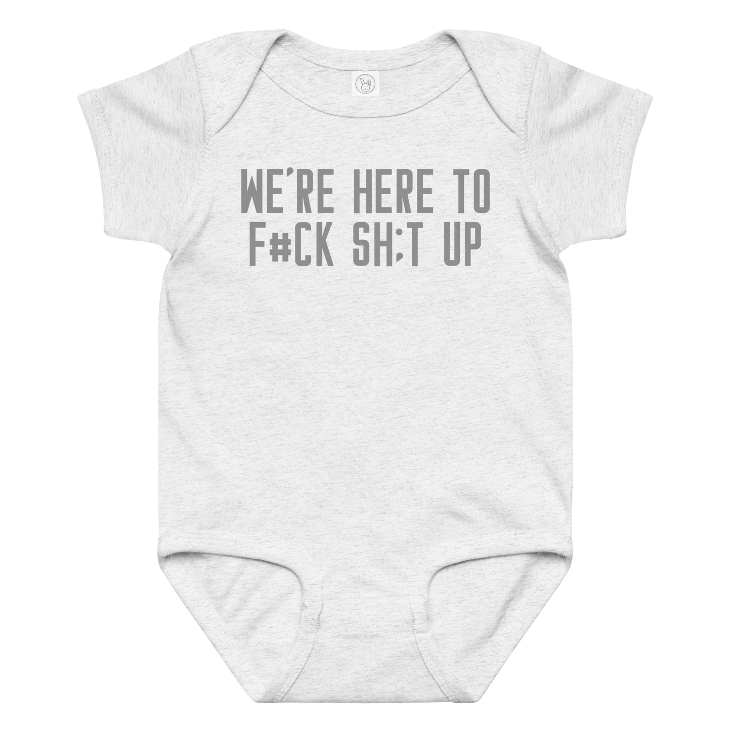 "We're Here To F#Ck Sh:t Up" printed on a ash baby jersey bodysuit laying on a flat surface amongst other clothes