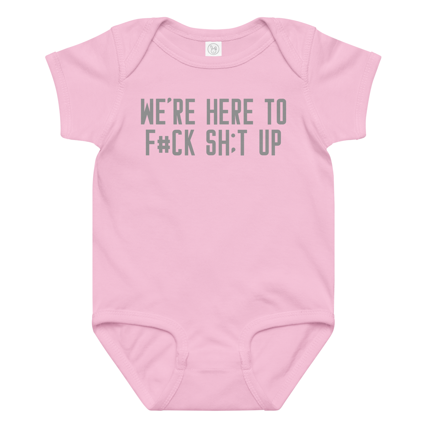 "We're Here To F#Ck Sh:t Up" printed on a pink baby jersey bodysuit laying on a flat surface amongst other clothes