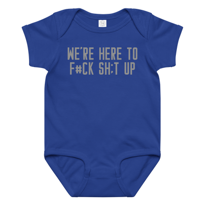 "We're Here To F#Ck Sh:t Up" printed on a royal baby jersey bodysuit laying on a flat surface amongst other clothes