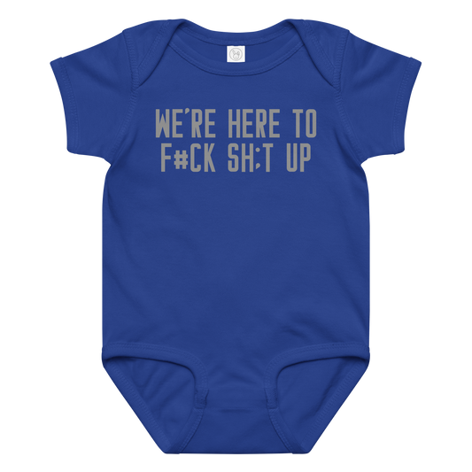 "We're Here To F#Ck Sh:t Up" printed on a royal baby jersey bodysuit laying on a flat surface amongst other clothes