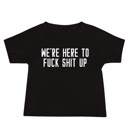 "We're Here To Fuck Shit Up" printed on a black baby jersey short sleeve tee laying on a flat surface