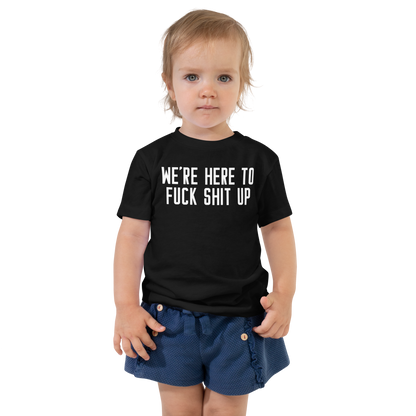 "We're Here To Fuck Shit Up" printed on a black toddler short sleeve tee worn by a female
