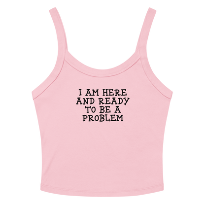 "I am here and ready to be a problem" printed on a solid pink blend women's micro-rib tanktop laying on a flat surface amongst sunglasses and shorts