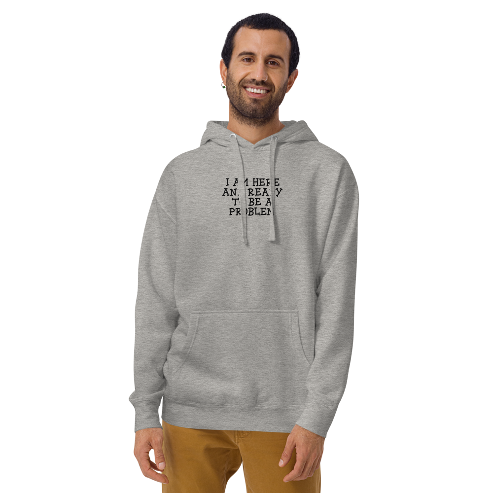 "I am here and ready to be a problem" printed on a carbon grey warn by a male