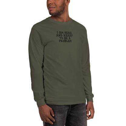 "I am here and ready to be a problem" printed on a military green men's long sleeve shirt worn by a male