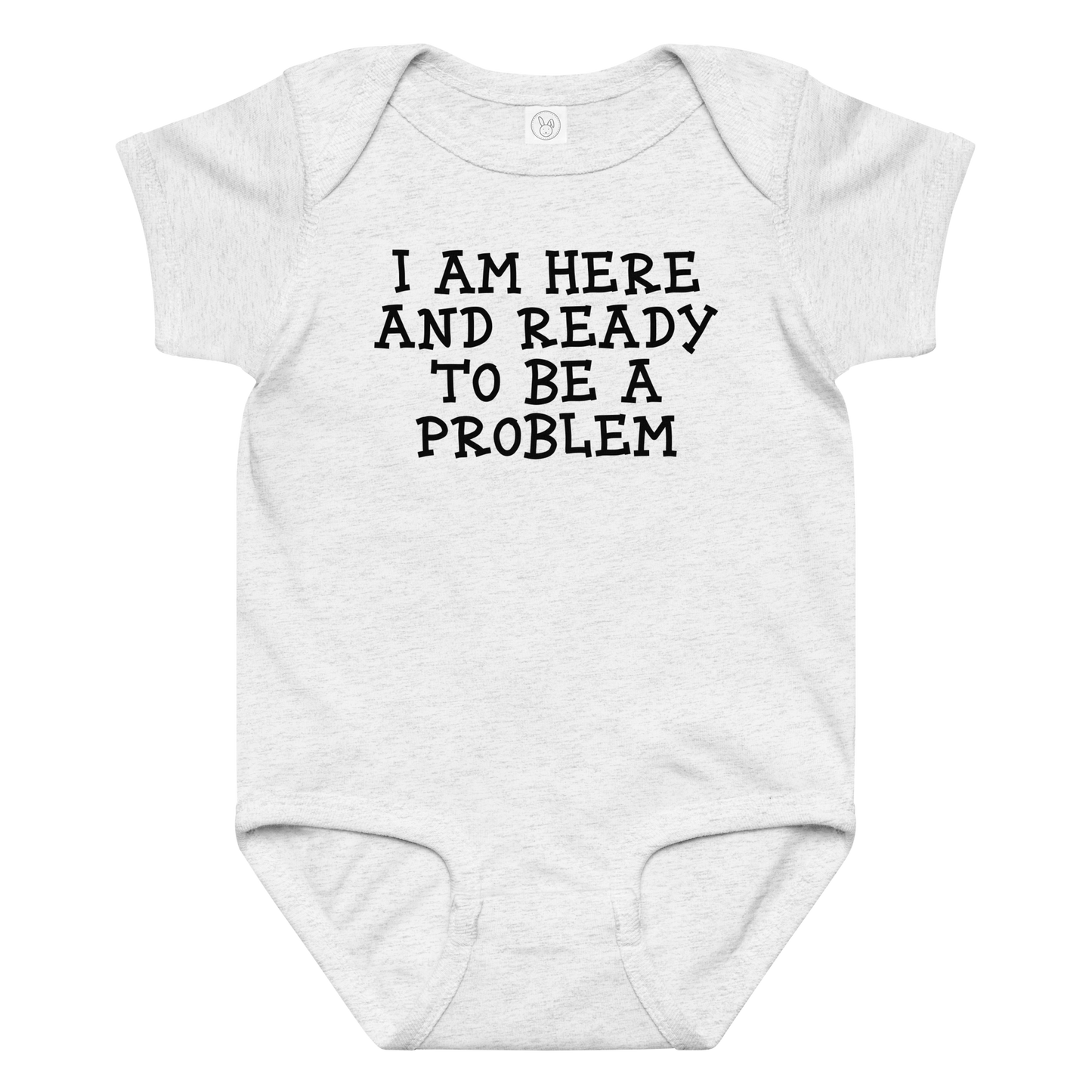 "I am here and ready to be a problem" printed on a ash baby jersey bodysuit laying on a flat surface amongst other clothes