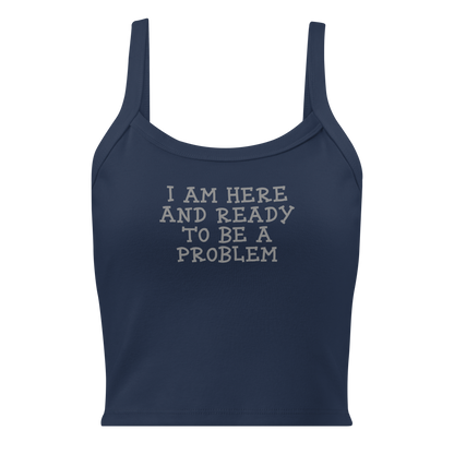 "I am here and ready to be a problem" printed on a solid navy blend women's micro-rib tanktop laying on a flat surface