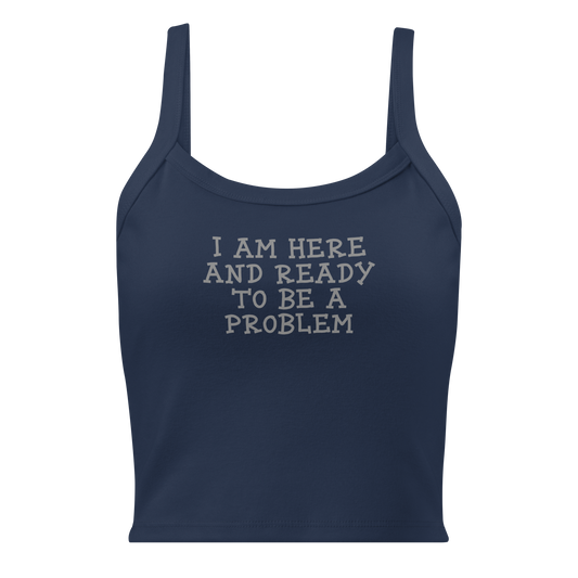 "I am here and ready to be a problem" printed on a solid navy blend women's micro-rib tanktop laying on a flat surface