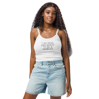 "I am here and ready to be a problem" printed on a solid white blend women's micro-rib tanktop worn by a female