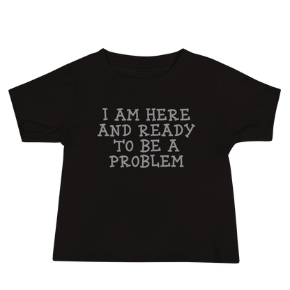 "I am here and ready to be a problem" printed on a black baby jersey short sleeve tee laying on a flat surface