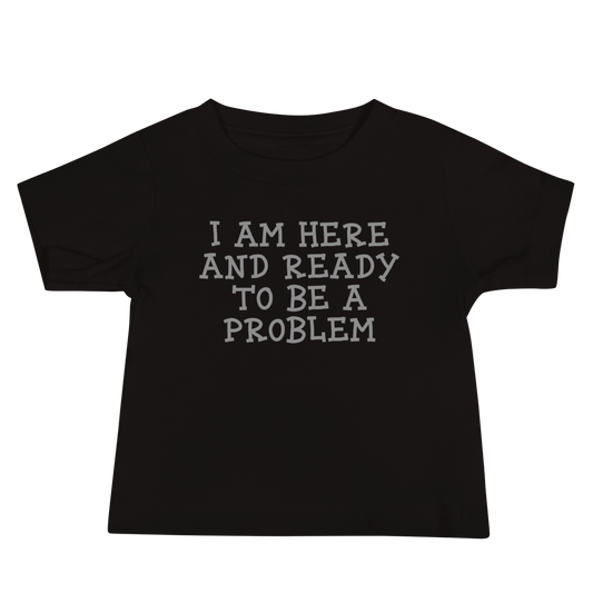 "I am here and ready to be a problem" printed on a black baby jersey short sleeve tee laying on a flat surface