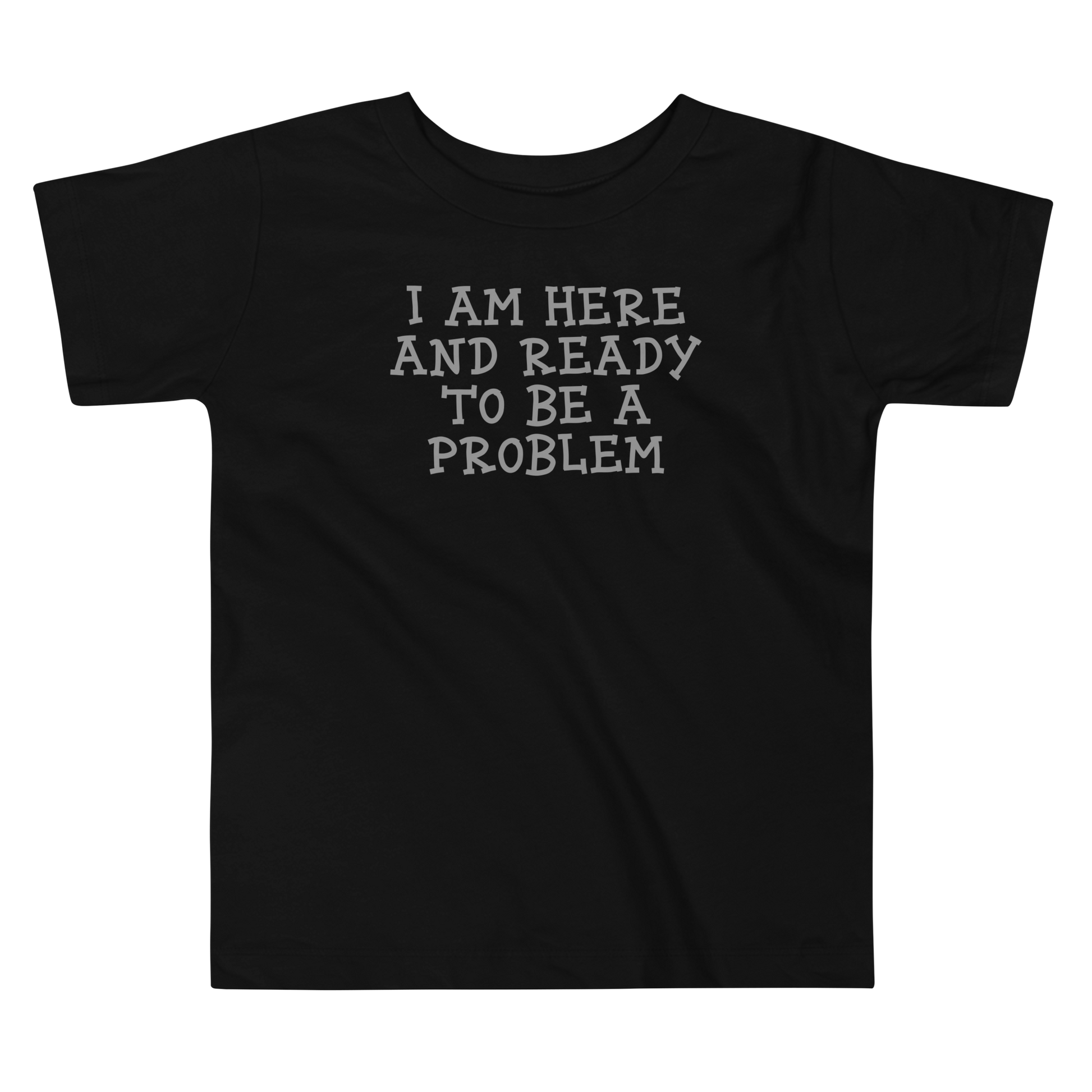 "I am here and ready to be a problem" printed on a black toddler short sleeve tee laying on a flat surface