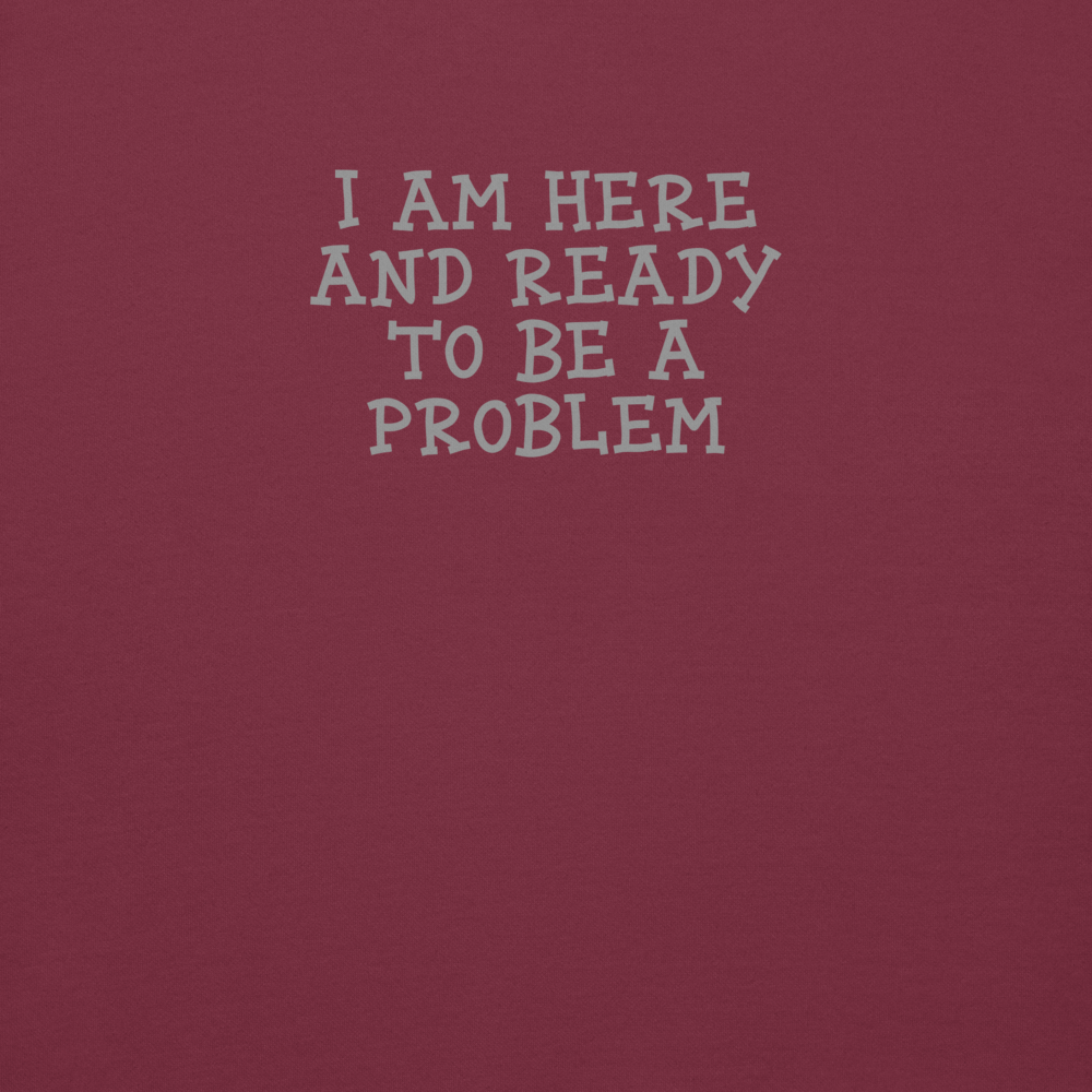 "I am here and ready to be a problem" printed on a maroon background