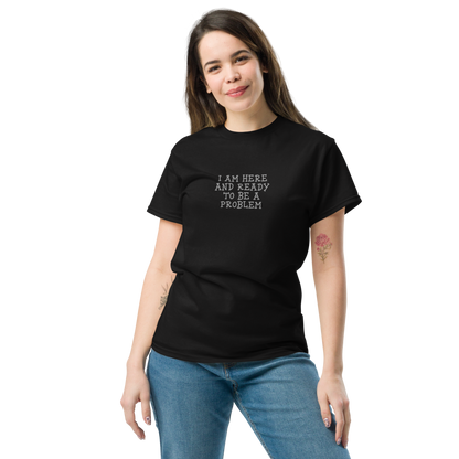 "I am here and ready to be a problem" printed on a black unisex classic tee worn by a female