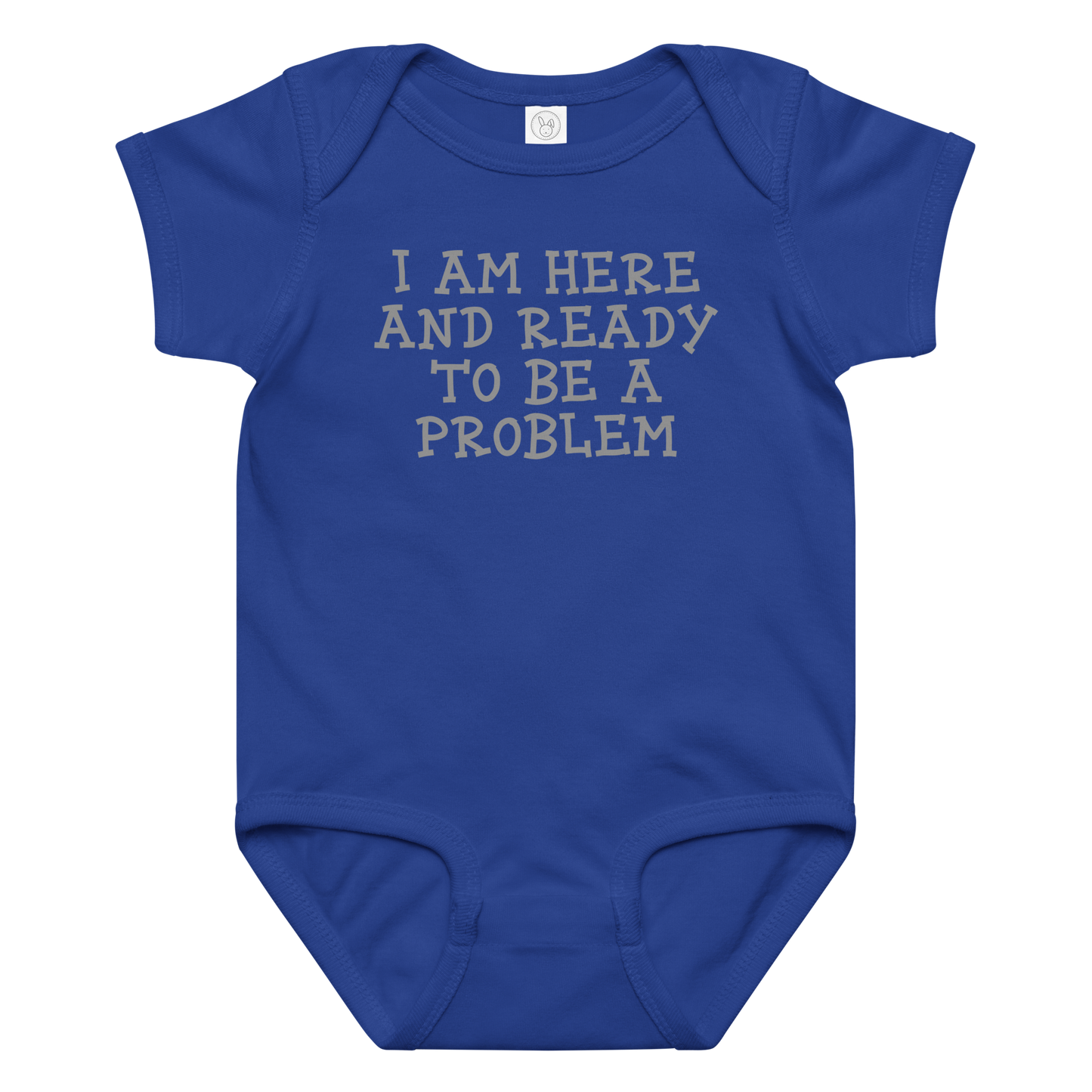 "I am here and ready to be a problem" printed on a royal baby jersey bodysuit laying on a flat surface amongst other clothes