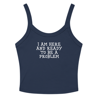 "I am here and ready to be a problem" printed on a solid navy blend women's micro-rib tanktop laying on a flat surface amongst sunglasses and shorts