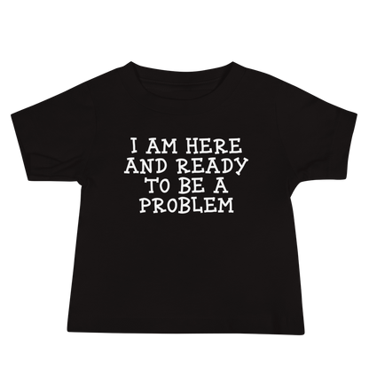 "I am here and ready to be a problem" printed on a black baby jersey short sleeve tee laying on a flat surface