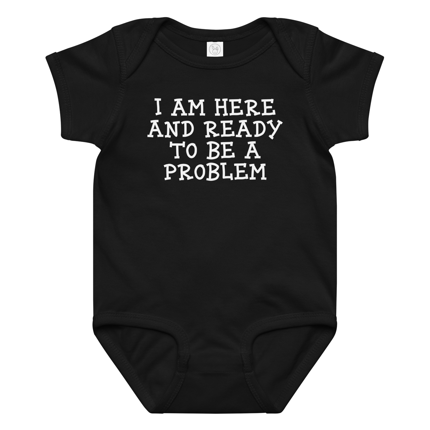 "I am here and ready to be a problem" printed on a black baby jersey bodysuit laying on a flat surface amongst other clothes