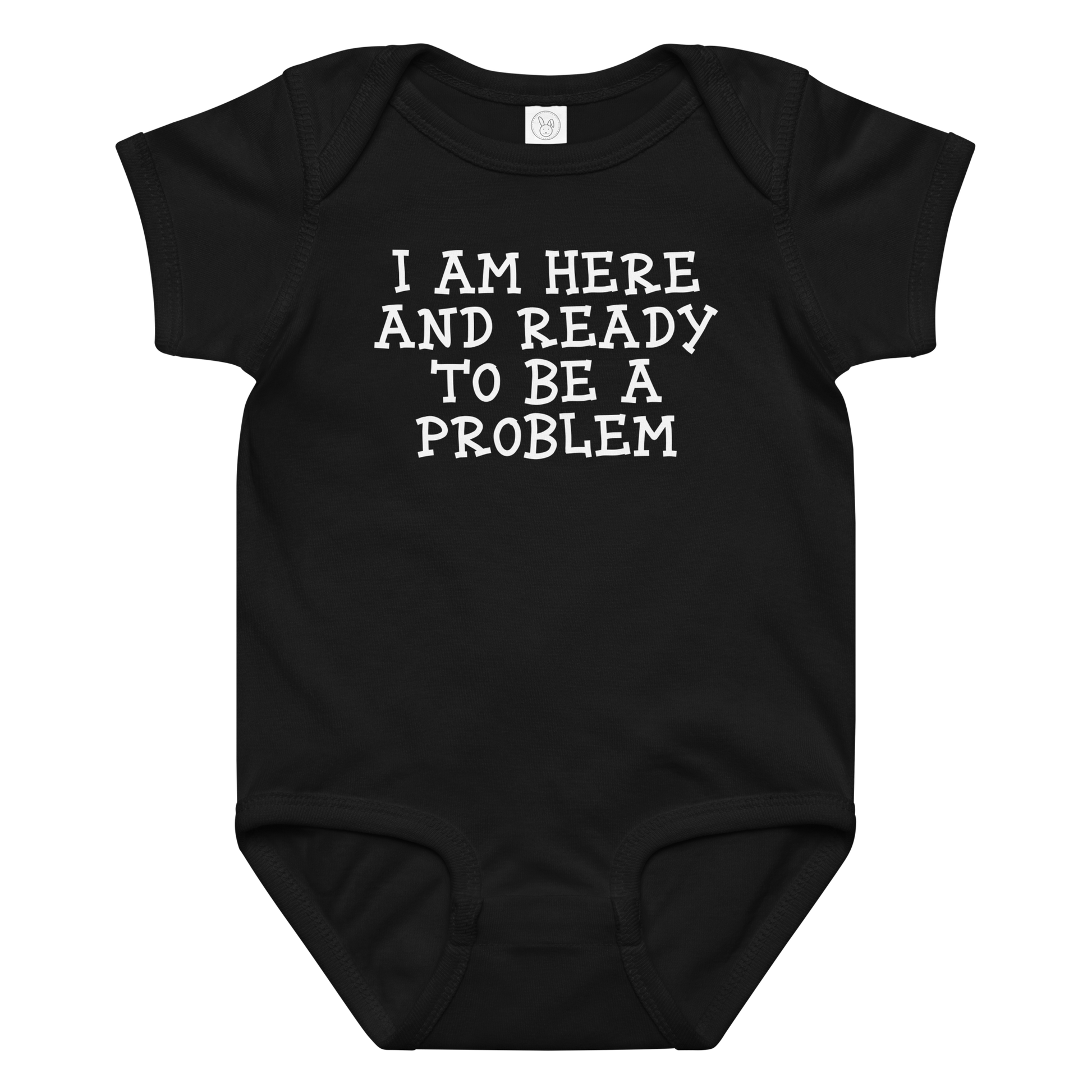"I am here and ready to be a problem" printed on a black baby jersey bodysuit laying on a flat surface amongst other clothes