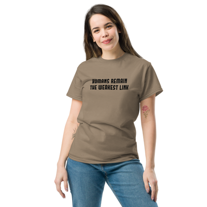 "Humans remain the weakest link" printed on a brown savana unisex classic tee worn by a female