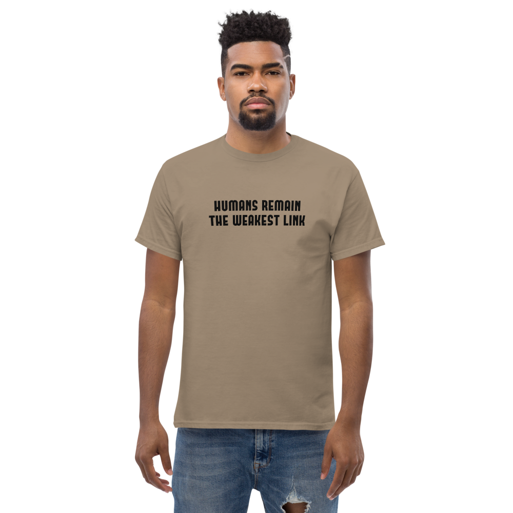 "Humans remain the weakest link" printed on a brown savana unisex classic tee worn by a male