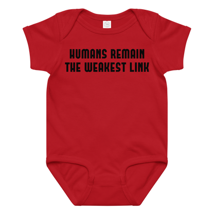 "Humans remain the weakest link" printed on a red baby jersey bodysuit laying on a flat surface amongst other clothes