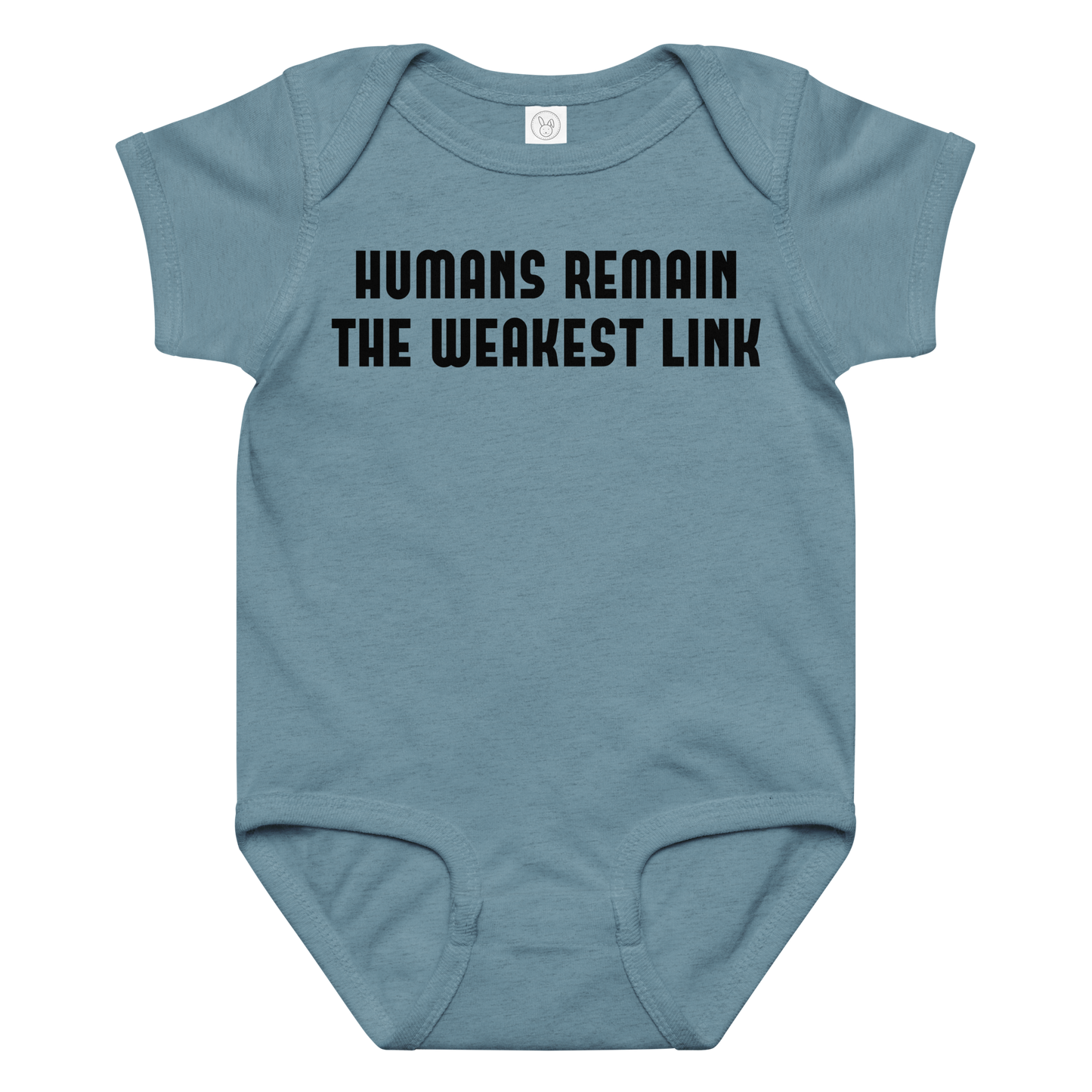 "Humans remain the weakest link" printed on a vintage indigo baby jersey bodysuit laying on a flat surface amongst other clothes