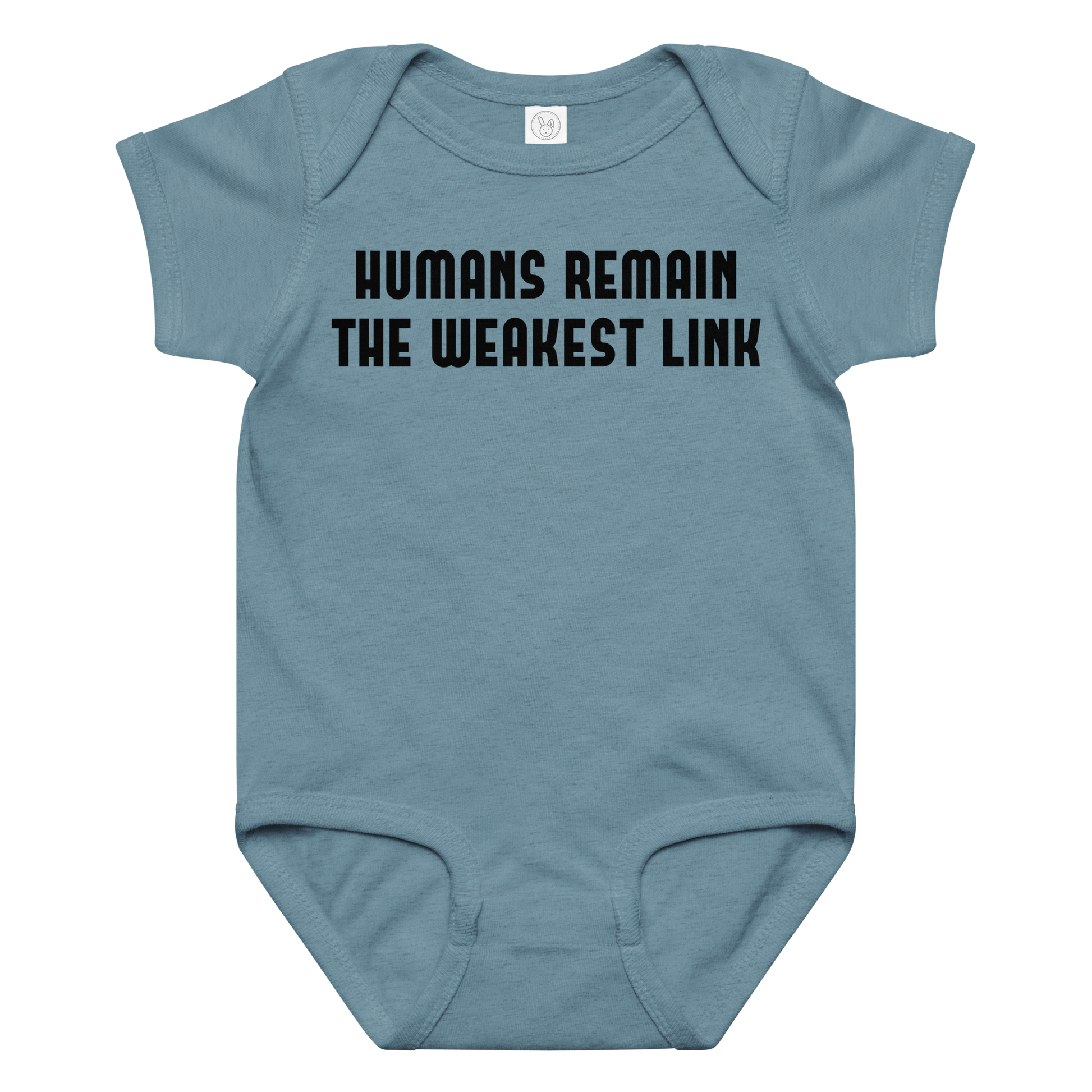 "Humans remain the weakest link" printed on a vintage indigo baby jersey bodysuit laying on a flat surface amongst other clothes