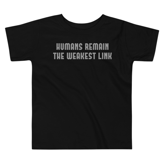 "Humans remain the weakest link" printed on a black toddler short sleeve tee laying on a flat surface
