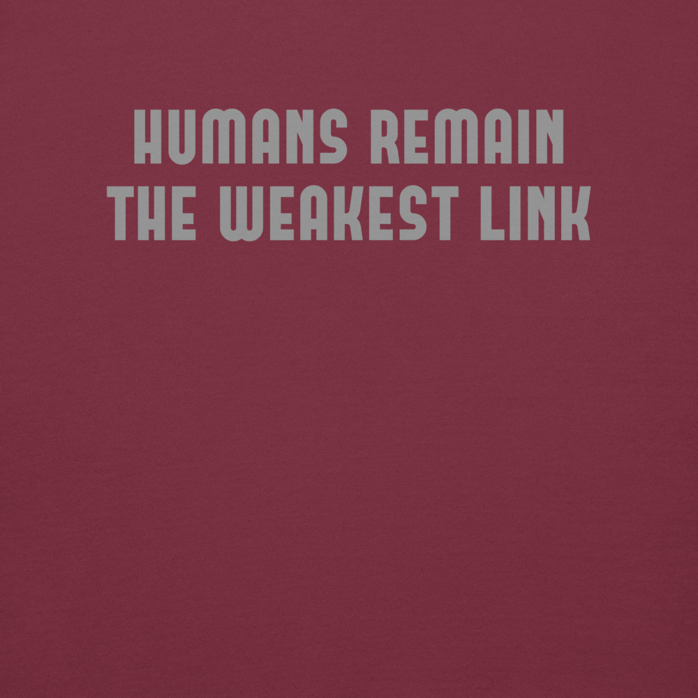 "Humans remain the weakest link" printed on a maroon background